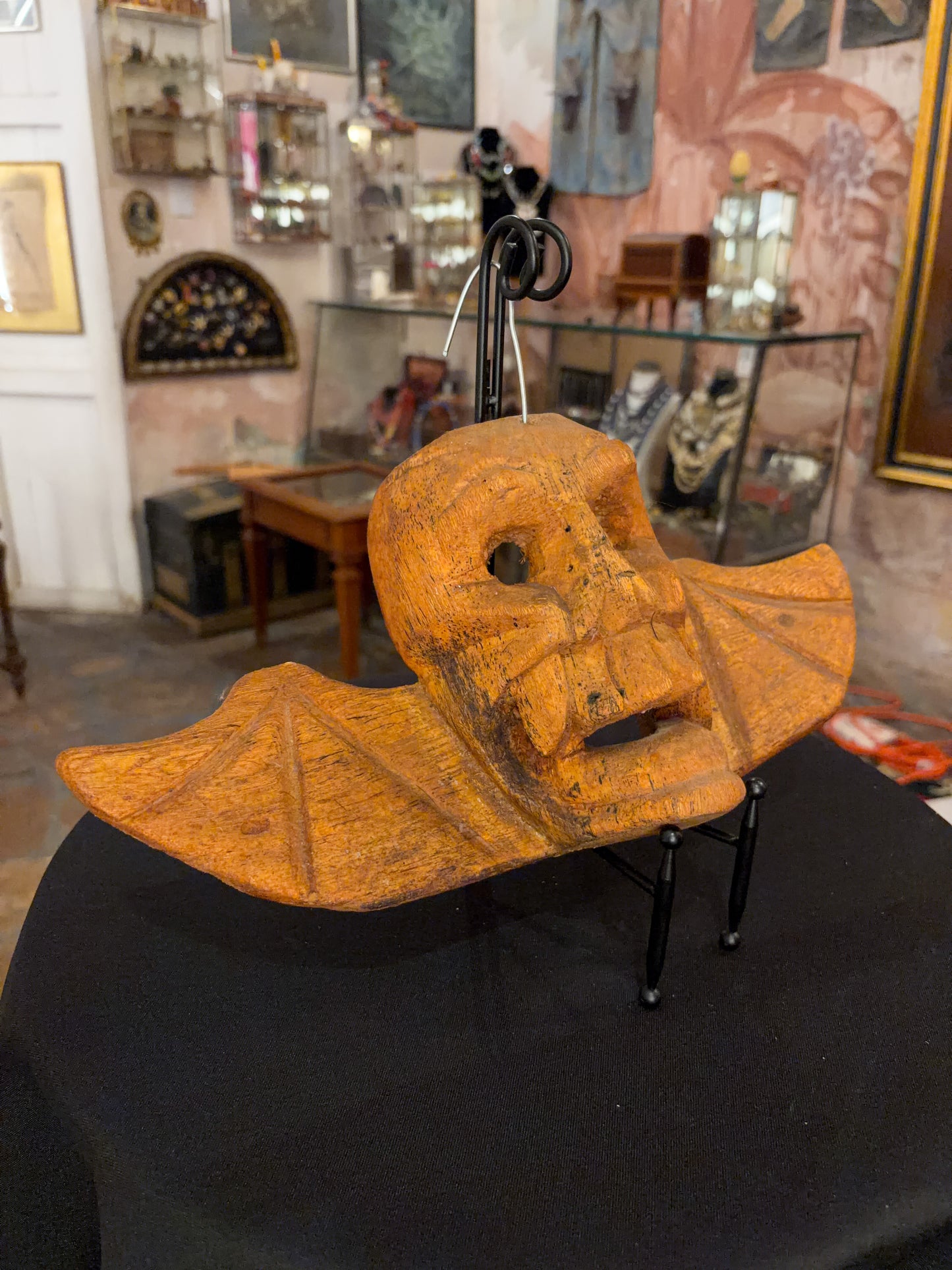Carved natural wood skull and bat wing dance mask, Michoacán Mexican folk art, side view