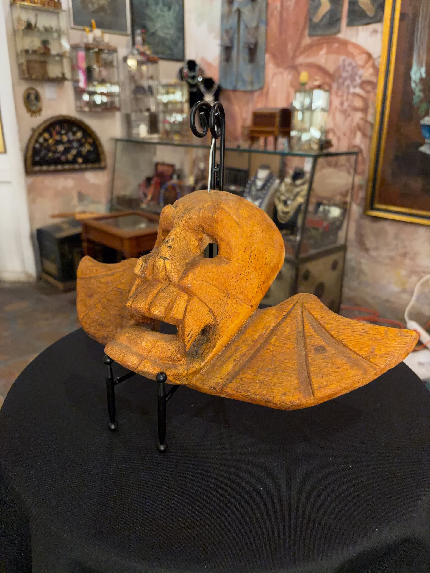 Carved natural wood skull and bat wing dance mask, Michoacán Mexican folk art, back view