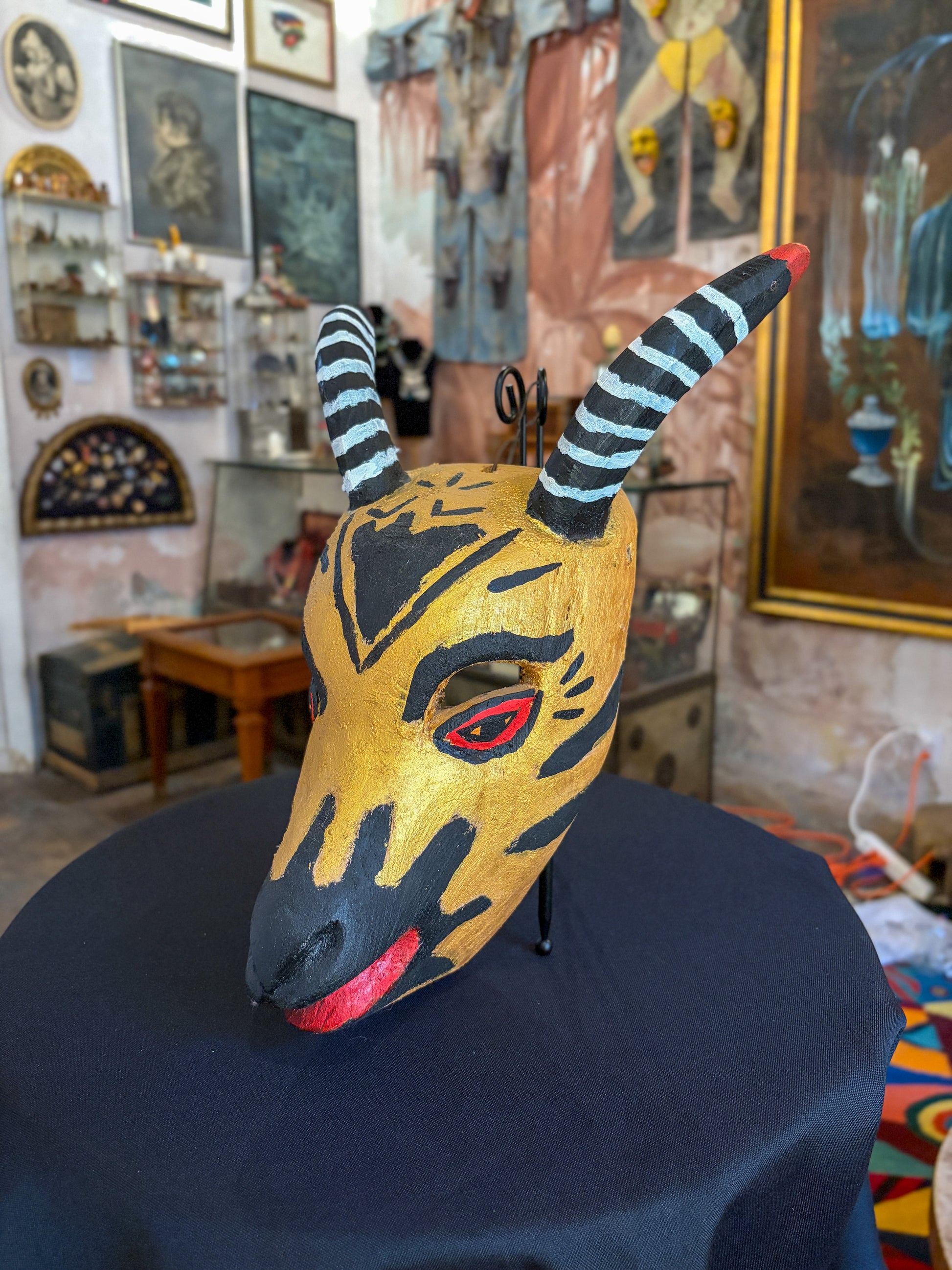 Hand-carved painted wood goat dance mask, Mexican folk art, side view