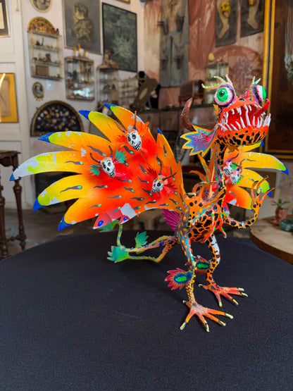 Handcrafted papier-mache alebrije dragon sculpture with skulls figure, Oaxacan Mexican folk art, back view