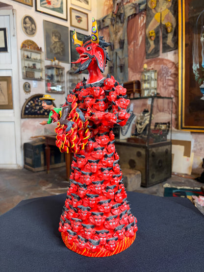 Polychrome fired clay devil figurine alebrije, Michoacán Mexican folk art, right side, demon holding tiny captive