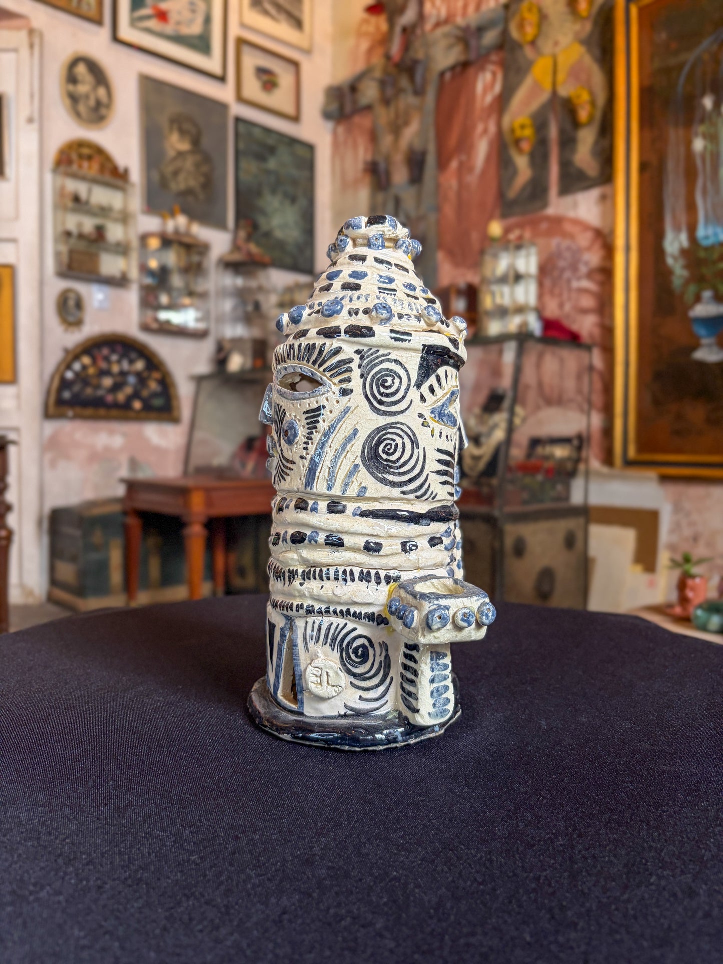 Handcrafted high-temperature ceramic triple candelabra with double-face pre-Hispanic, Morelos, Mexican folk art, side view