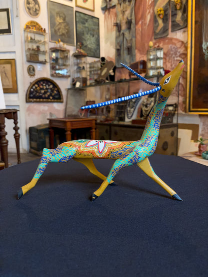 Handcrafted polychrome copal wood Oaxacan deer figure alebrije, Mexican folk art