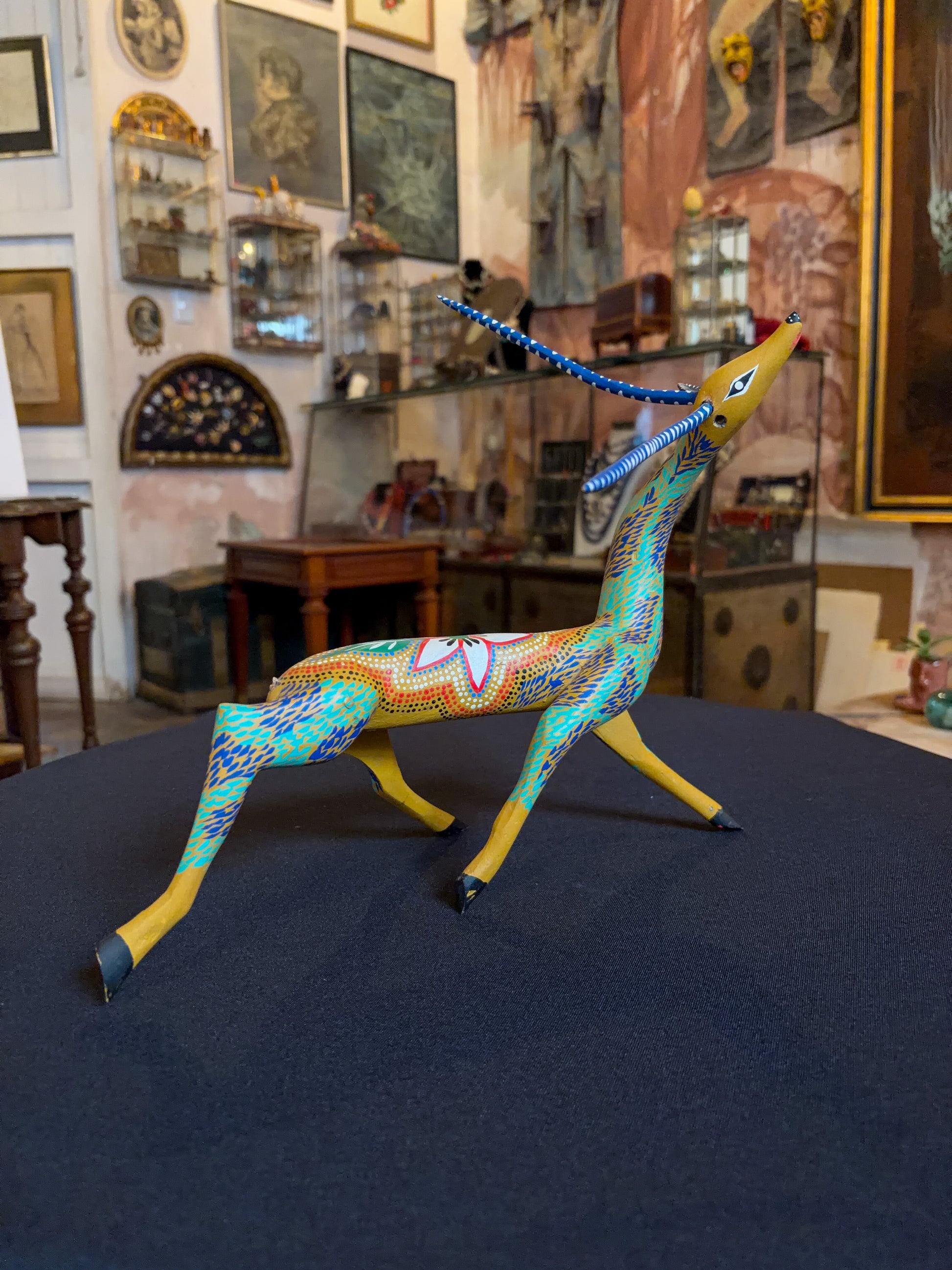Handcrafted polychrome copal wood Oaxacan deer figure alebrije, Mexican folk art, side view