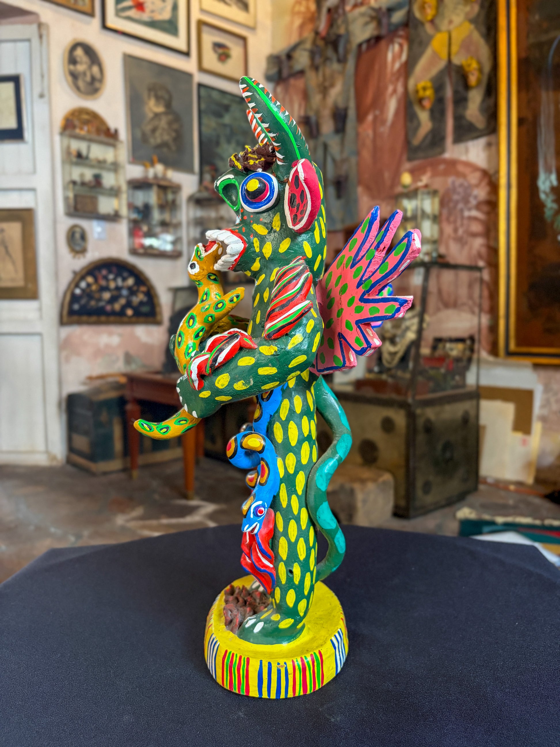 Polychrome fired clay devil figurine with lizard alebrije, Michoacán Mexican folk art, right side, face and lizard interaction