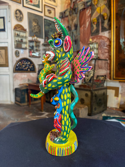 Polychrome fired clay devil figurine with lizard alebrije, Michoacán Mexican folk art, right side, face and lizard interaction