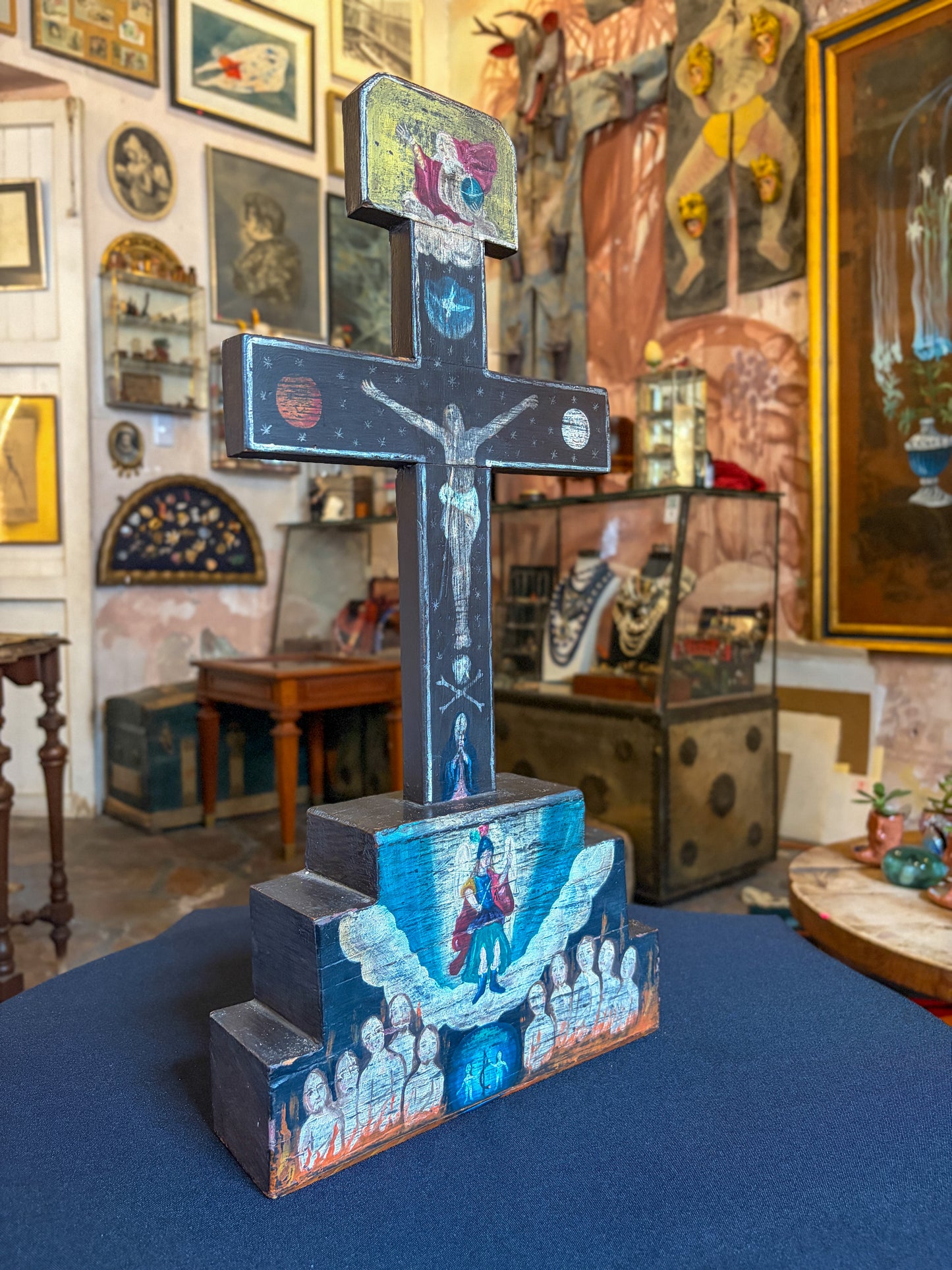 Antique polychrome carved wood devotional cross, Mexican folk art, angled cross view, painted base scenes