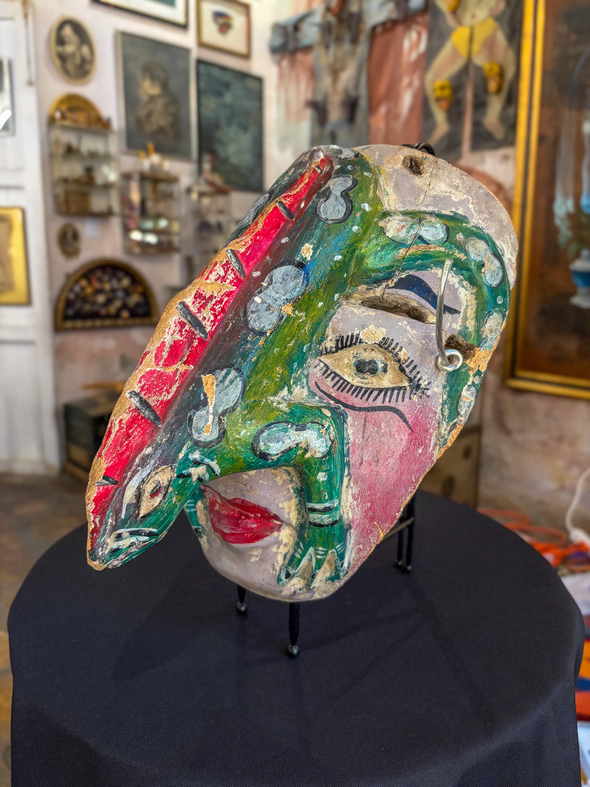 Hand-carved painted wood dance mask with reptile, Guerrero Mexican folk art, side view