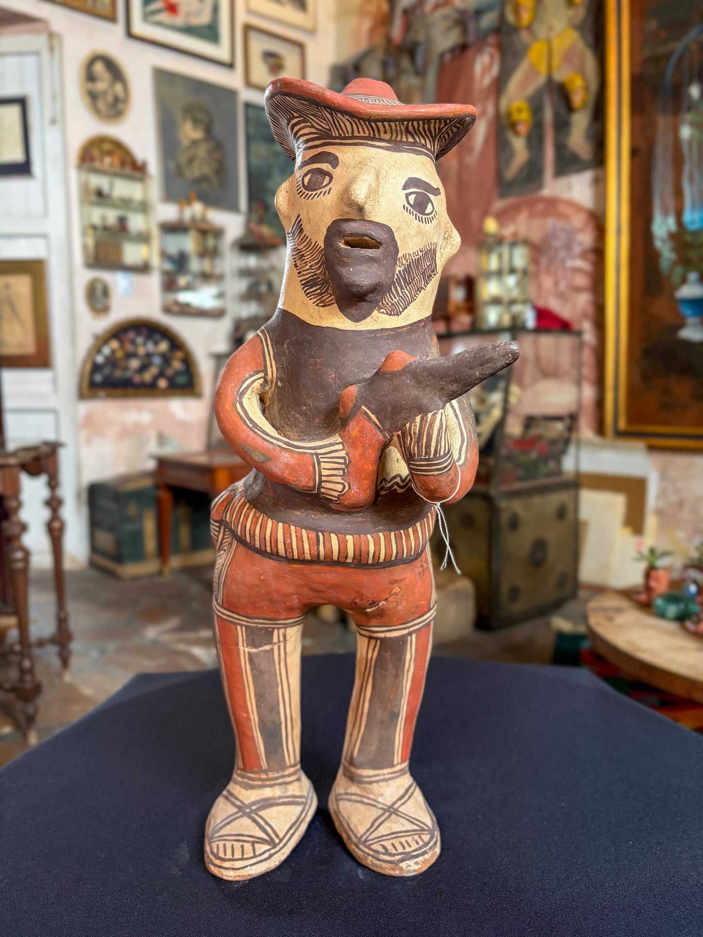Hand-modeled fired clay hunter figurine with mineral pigments, San Agustin Oapan Guerrero Mexico, circa 1980s, Mexican folk