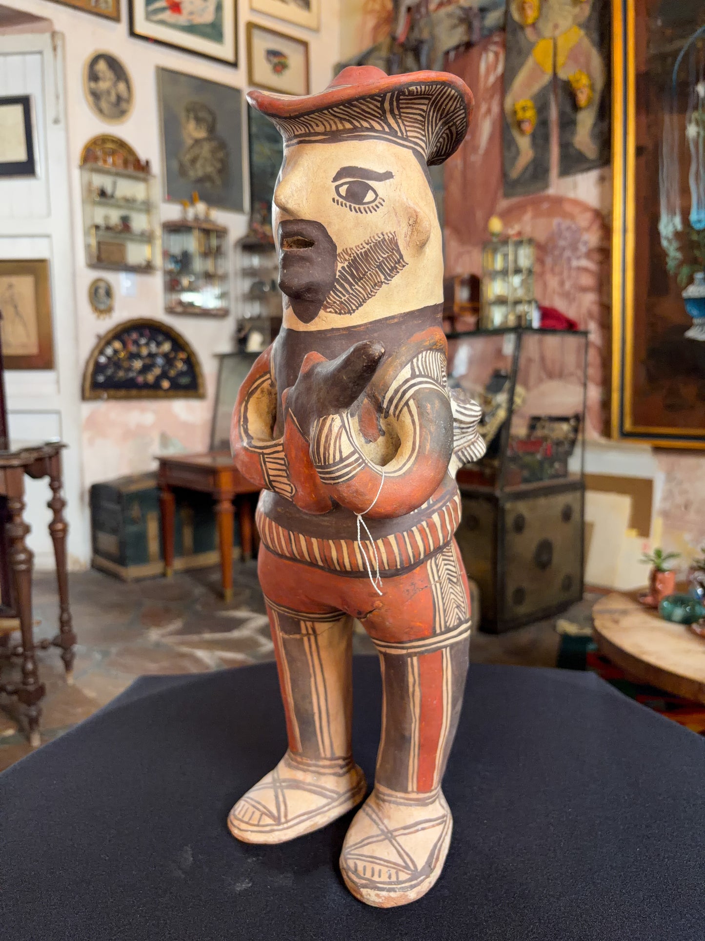 Hand-modeled fired clay hunter figurine with mineral pigments, San Agustin Oapan Guerrero Mexico, circa 1980s, side view
