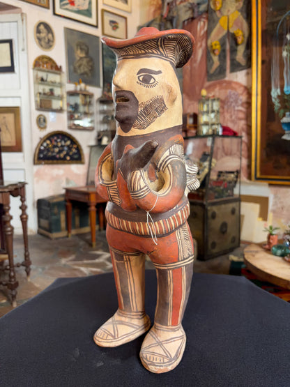 Hand-modeled fired clay hunter figurine with mineral pigments, San Agustin Oapan Guerrero Mexico, circa 1980s, side view