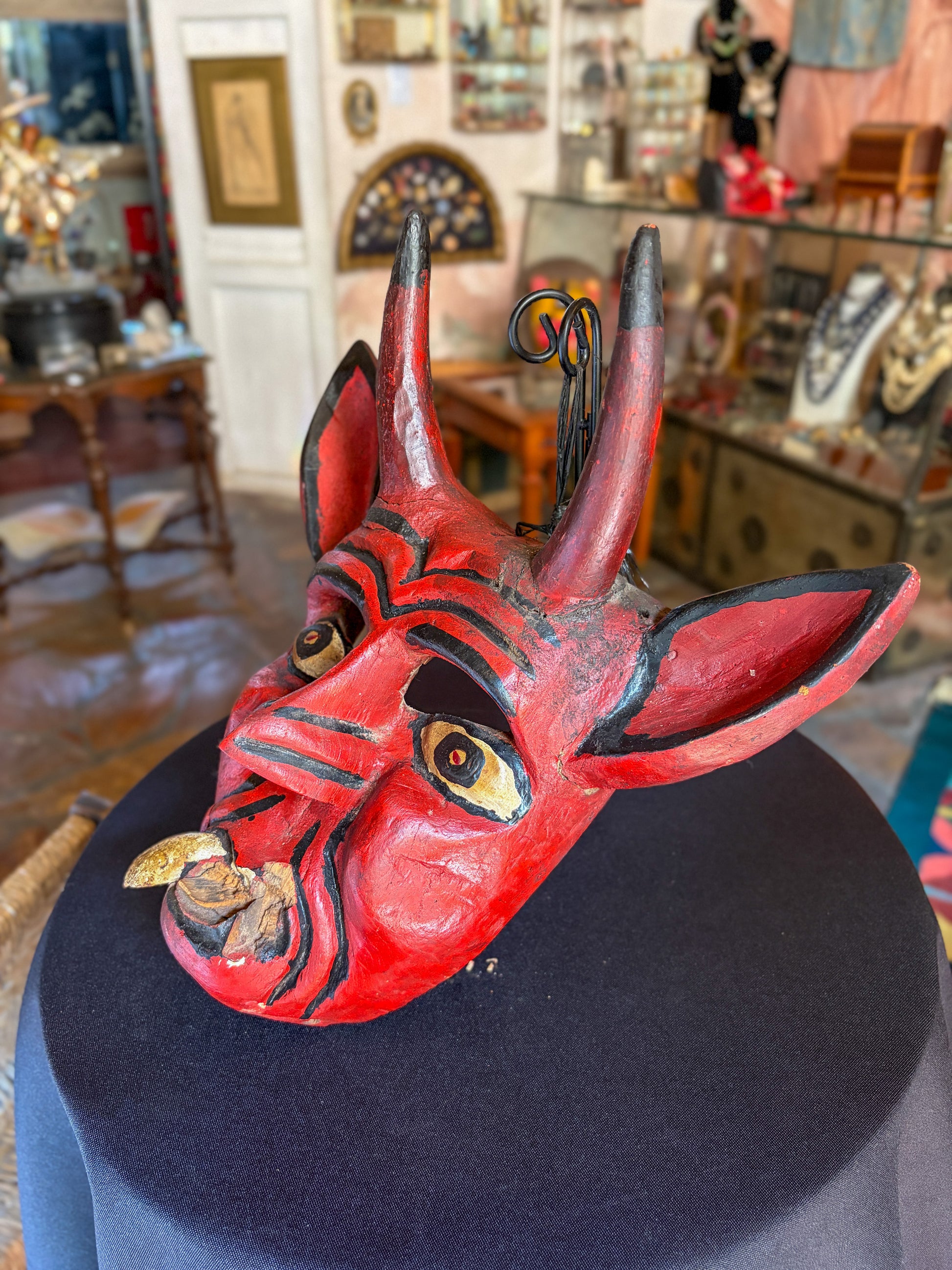 Handcrafted polychrome carved wood red devil dance mask, Guerrero Mexican folk art, side view