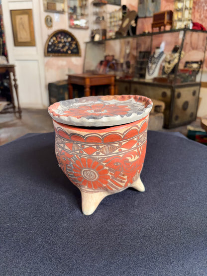Handcrafted baked clay three-legged vessel with freehand mineral slip decoration, Oaxaca, Guerrero Mexican folk, side view