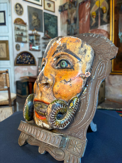 Handcrafted polychrome carved wood dance mask with serpent crossing the mouth, Chilapa Guerrero Mexico, circa 1950s, side view