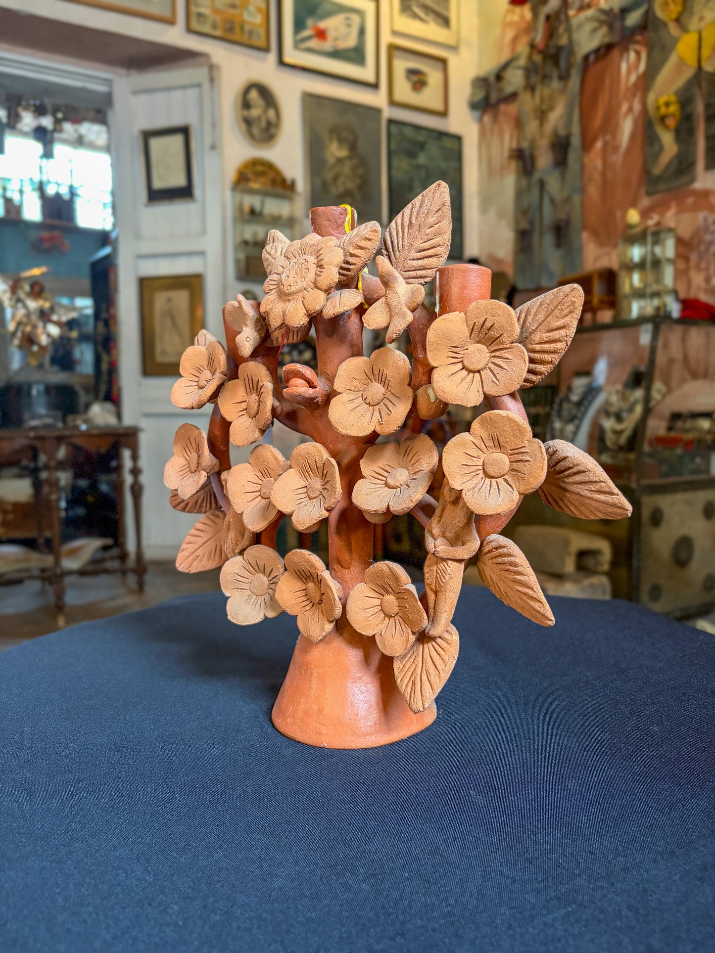 Handcrafted painted clay tree of life with floral design, Mexican folk art, side view