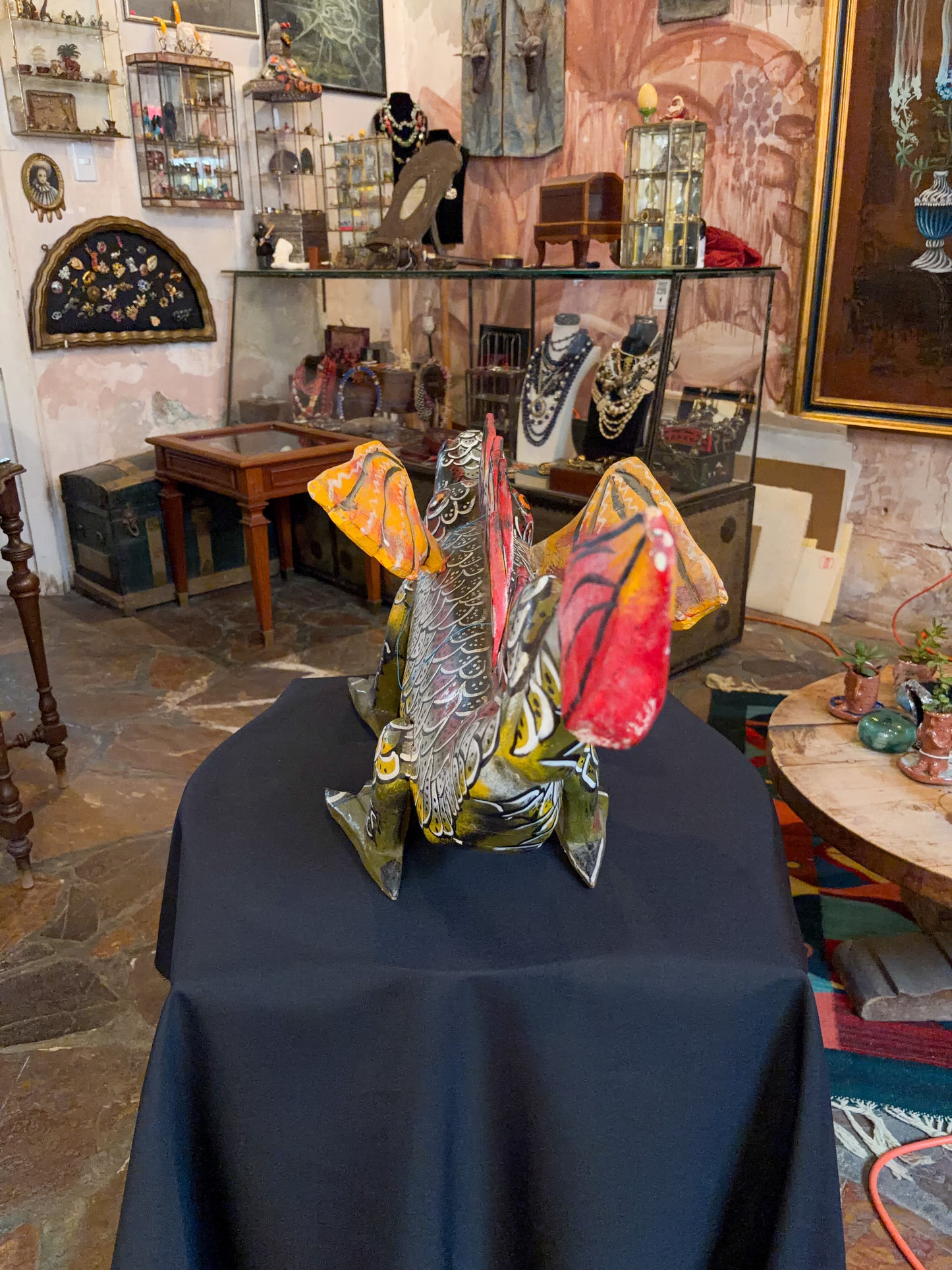 Polychrome carved wood winged dragon sculpture alebrije, Guerrero Mexican folk art, back view, spread yellow wings